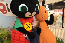 Niamh Wallace, seven, of Halton, gives Bing a big hug