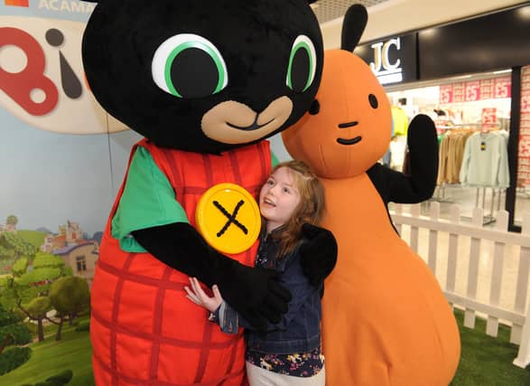Niamh Wallace, seven, of Halton, gives Bing a big hug