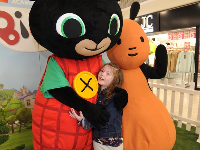 Niamh Wallace, seven, of Halton, gives Bing a big hug