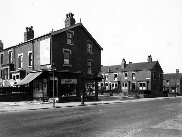 Ingle's fruit and flowers and number 360, Craven's tobacconists on Harehills Lane, between Brownhill and Sutherland Terraces. Sutherland Mount visible. Streetlamp, postbox and advertisements for "Wisk", Lyon's chocolate and Gold Flake tobacco visible. Pictured in September 1949.
