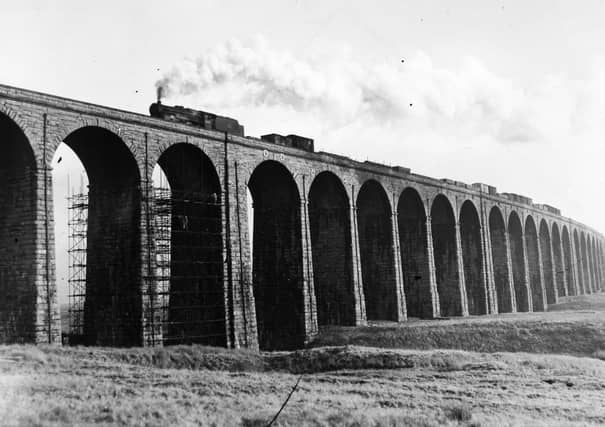 A steam train passes over Ribblehead Viaduct in January 1960.