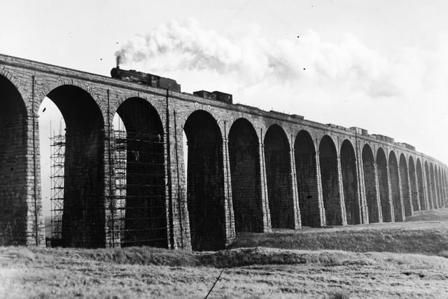A steam train passes over Ribblehead Viaduct in January 1960.