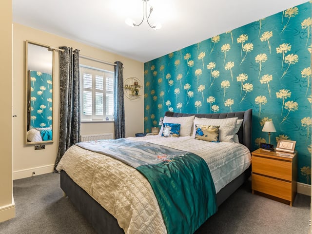 A double bedroom is also located on the first floor and is complete with fitted wardrobes and an en-suite shower room.