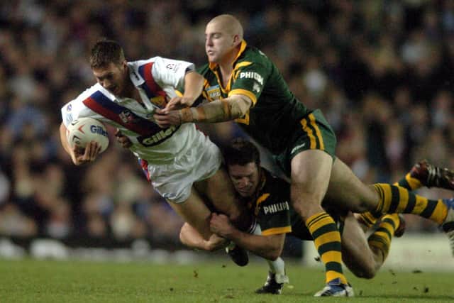 Leeds Rhinos' Danny McGuire is tackled during Australia's win over Great Britain in ther 2004 Tri-Nations final at Elland Road. Picture by Steve Riding.