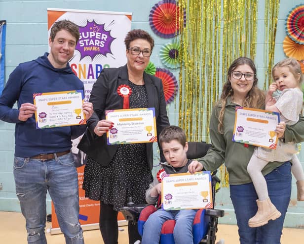 SNAPS Super Star Phoenix receiving his certificate at last year's Super Stars awards, with his family