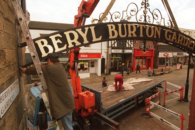 Workmen start to raise the Beryl Burton Arch into place on Queen Street in November 1997.