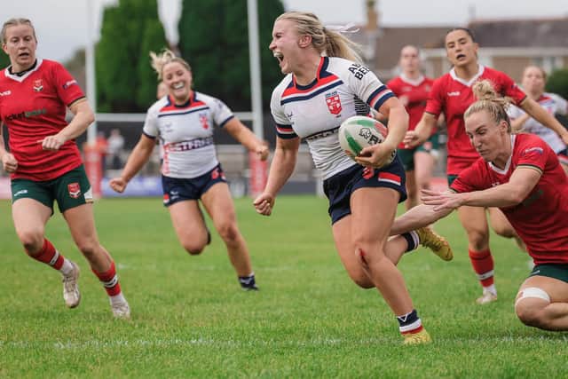 Leeds Rhinos' Bella Sykes seen scoring for England against Wales in Neath last August. Picture by Alex Whitehead/SWpix.com.