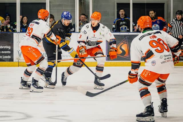 WE MEET AGAIN: Leeds Knights' Bailey Perre and Sheffield Streeldogs' Liam Steele battle for the puck during Saturday's clash at Elland Road, which the visitors won 6-4. Picture: Rob Halls/Knights Media.