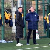 Former Rhinos captain and rugby boss Kevin Sinfield, left, watches his old club train today (Thursday) with club commercial director Rob Oates (middle) and coach Rohan Smith. Picture by Simon Hulme.