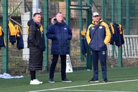 Former Rhinos captain and rugby boss Kevin Sinfield, left, watches his old club train today (Thursday) with club commercial director Rob Oates (middle) and coach Rohan Smith. Picture by Simon Hulme.