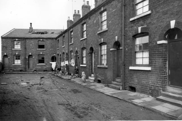 Castleton Terrace in February 1964. It was comprised of 12 houses which formed the 'L' shape seen here.