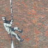 Banksy has yet to confirm whether he painted the prisoner escaping on the HMP Reading wall (Picture: BBC)