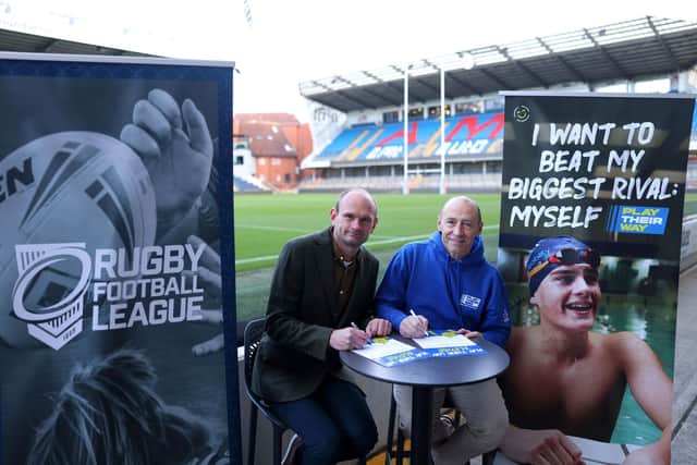 Mark Gannon, CEO of UK Coaching, and David Raybould, National Development Manager for the RFL, sign the Play Their Way Pledge at Headingley.