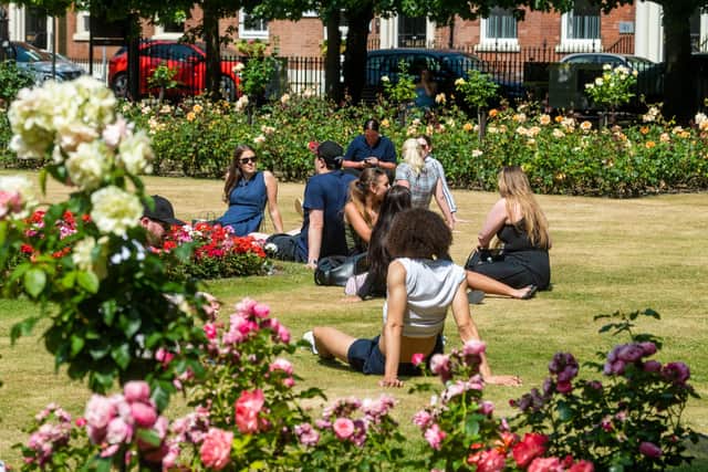 Office workers in Park Square, Leeds, enjoying the warm weather.