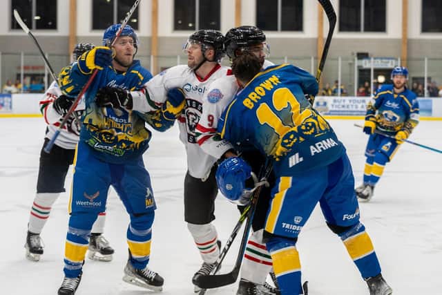 STANDING TALL> Leeds Knights' Matt Haywood (left) and Kieran Brown get up close and personal with their Basingstoke rivals on Sunday. Picture courtesy of Anna Alarie