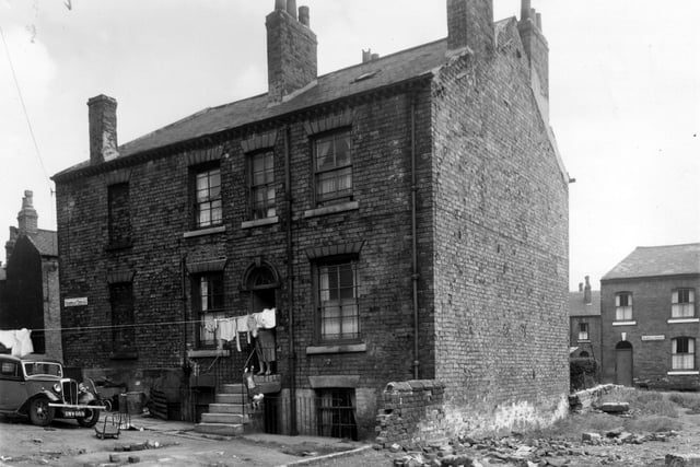Sheepscar Terrace is in an area where some demolition had taken place in July 1958. The house to the left is bricked up. Sackville Street was on the other side of these houses.