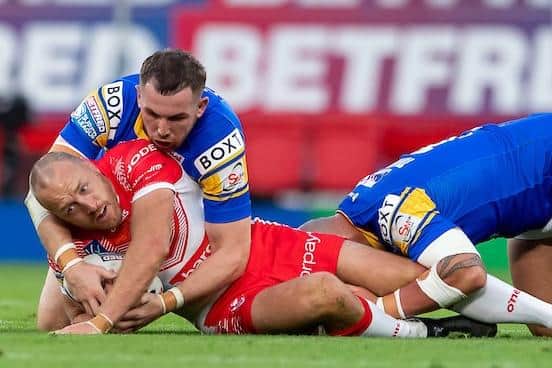James Roby is tackled by Leeds' Cameron Smith during last year's Super League Grand Final. Picture by Allan McKenzie/SWpix.com.