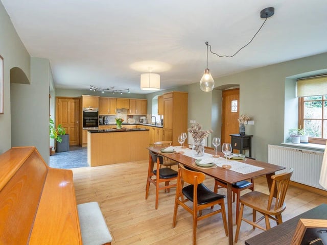 The room is flooded with natural light via the oversized patio doors leading to the rear garden and patio.