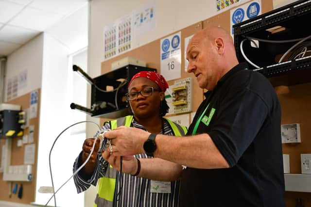 Tutor with learner on an Aim2Learn course at their Sugar Mill centre, Leeds