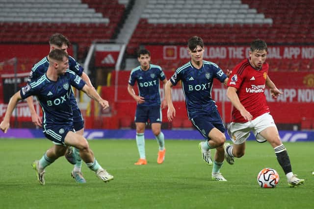'REAL POTENTIAL': Seventeen-year-old Leeds United midfielder Charlie Crew, second right, pictured chasing Manchester United's Daniel Gore in August's Premier League 2 clash at Old Trafford. Photo by John Peters/Manchester United via Getty Images.