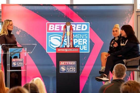 Rhinos captain Hanna Butcher (with microphone) and York's Sinead Peach chat to Sky TV's Jenna Brooks at the Betfred Women's Super League launch at Headingley. Picture by Allan McKenzie/SWpix.com.