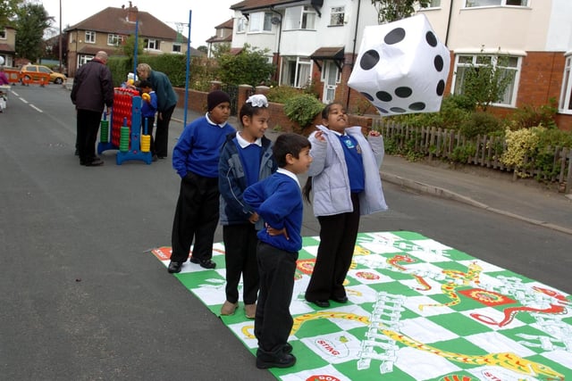 Pupils from Talbot Primary School in Roundhay play snakes and ladders in the street as part of the In Town Without My Car Day initiative.