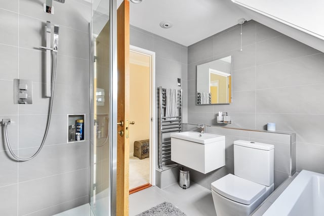 Italian, contemporary style bathrooms feature within the property.