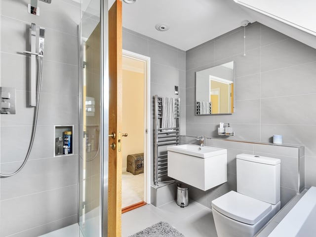 Italian, contemporary style bathrooms feature within the property.
