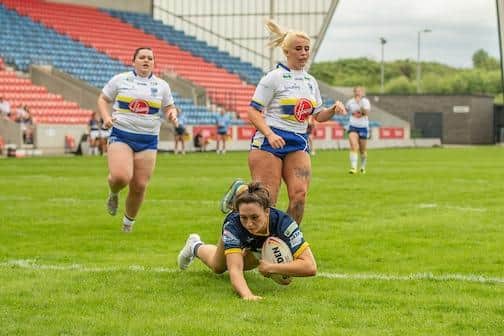 Ruby Enright, seen scoring against Warrington at the recent Nines tournament, has been named in Rhinos' Wembley squad after an injury scare. Picture by Olly Hassell/SWpix.com.