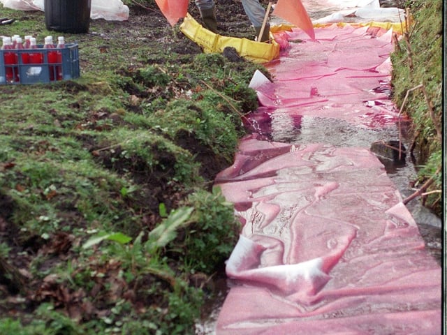 Nick Reynolds of the Environment Agency cleans Adel Beck in March 1999.