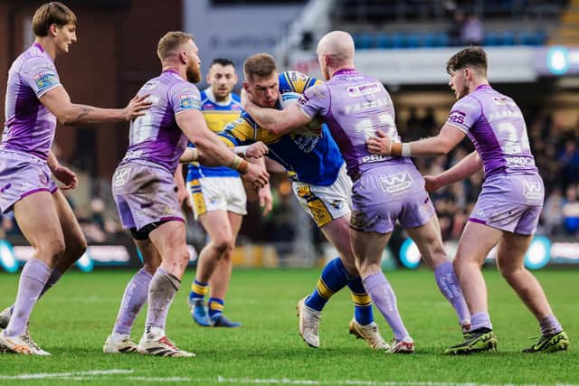 Tom Holroyd, seen in action against Wigan Warriors, has been named in Leeds Rhinos' 21-man squad to face Catalans Dragons after eight games on the casualty list. Picture by Alex Whitehead/SWpix.com