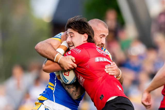 Joe Shorrocks is tackled by Leeds Rhinos' Jarrod O'Connor during Salford Red Devils 42-6 defeat at AMT Headingley in July. That was his last game for Salford before a loan move to Leeds. Picture by Allan McKenzie/SWpix.com.