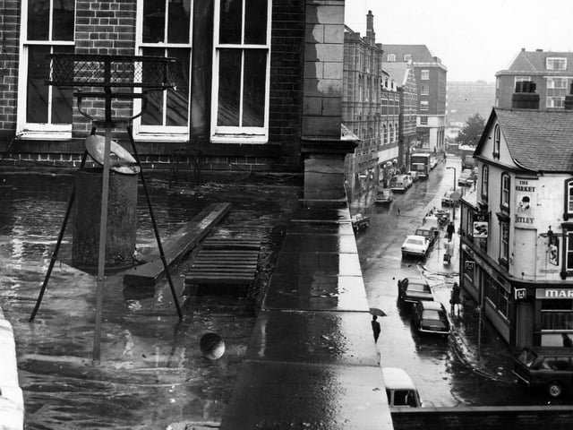 George Street side of Kirkgate Market, looking down to the north on George Street and Harewood Street in January 1979. In the foreground are upper storeys of the market building and down below on George Street the Market Tavern can be seen.