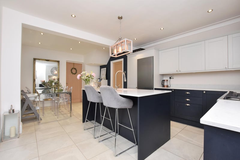 The kitchen is fitted with a range of Shaker style wall and base units with quartz worktops. There's also space for a range cooker and fridge freezer.