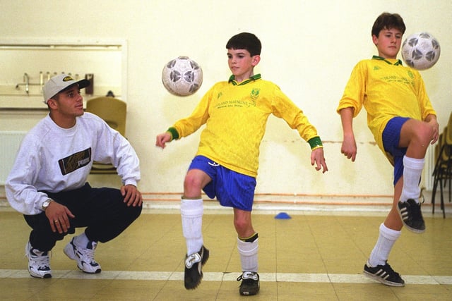 Bradford City's Brazilian star, Edhino, coaches young footballers, Steven Doherty, left, and Matthew Johnson, at Corpus Christi Parish Hall in November 1997. The pair were members of Jogar Brasileiro.