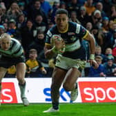 David Fusitua on his way to scoring for Rhinos against Hull.  Picture by Bruce Rollinson.