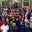Headingley Primary headteacher Frank Sheldrick is pictured with jubilant pupils in December 1999 after the school came joint second in a list of top performers in the country.