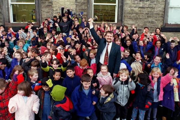 Headingley Primary headteacher Frank Sheldrick is pictured with jubilant pupils in December 1999 after the school came joint second in a list of top performers in the country.