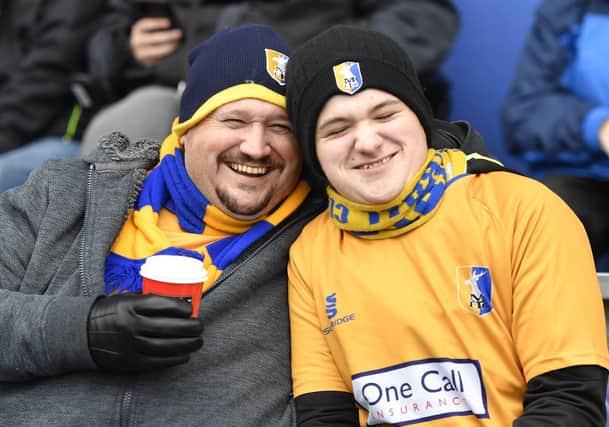 The two fans enjoy the build up to Mansfield Town v MK Dons.