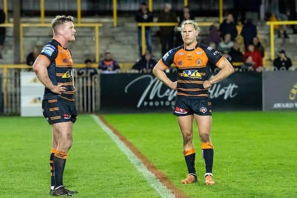 Tigers' Adam Milner, left, with teammate Jacob Miller following the loss to Warrington. Picture by Allan McKenzie/SWpix.com.