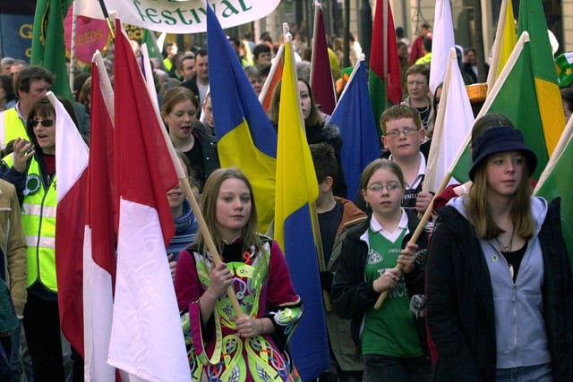 Youngsters carrying multi-coloured flags, taking part in the St Patrick's Day parade through Leeds city centre on March 16, 2003.