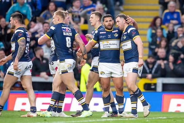 Cameron Smith, right of picture, is congratulated by teammate Rhyse Martin after scoring in Rhinos' win over Huddersfield. Picture by Allan McKenzie/SWpix.com.