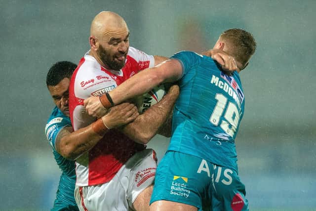 James McDonnell, right, aided by Sam Lisone, gets to grips with Hull KR's Kane Linnett. Picture by Bruce Rollinson.