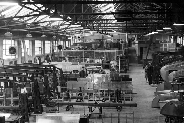 Inside the assembly shop at Olympia Works for Blackburn Firebrand IV tail planes elevators. Elevator assembly jigs on the left, tail plane assembly jigs on the right.