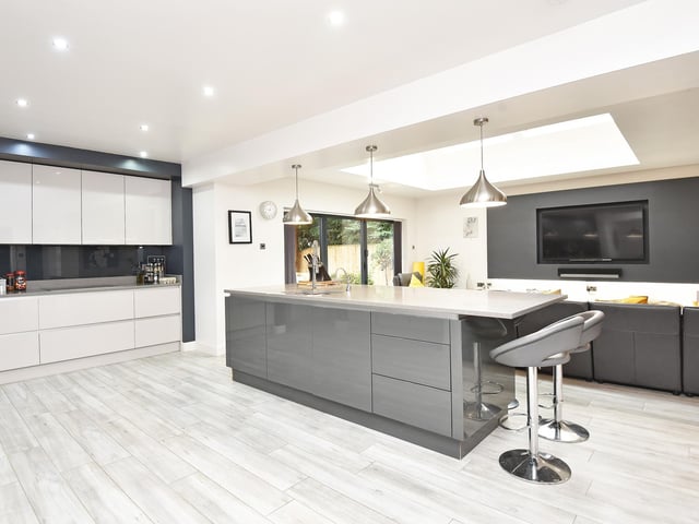 The spacious kitchen with central island is open plan to both family and dining areas.