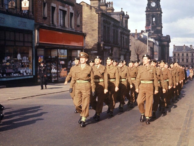 Members of the TA (Territorial Army) marching in the procession behind the Salvation Army Band. The Drill Hall in Ackroyd Street was opened amid great flourish by General Baldock in 1912, but was closed a year after the parade shown here in 1962. Morley Territorials were always connected with the Tank Regiment hence the black berets being worn here.