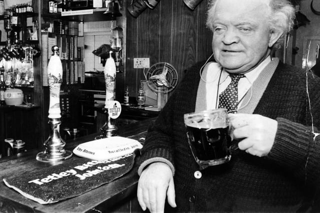Poet and writer Ronald C. Scriven, who overcame the handicaps of blindness and deafness, is pictured enjoying a pint at the Old Mexborough in Thorner in December 1972.