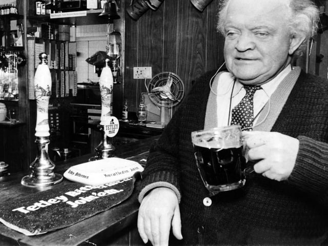 Poet and writer Ronald C. Scriven, who overcame the handicaps of blindness and deafness, is pictured enjoying a pint at the Old Mexborough in Thorner in December 1972.