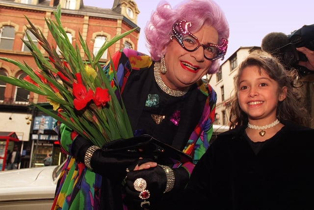 Dame Edna is presented with a bunch of gladioli by Rosha Bassiri, 10, from Alwoodley. The flowers were frequently mentioned in sketches as being the popular character's favourite.
