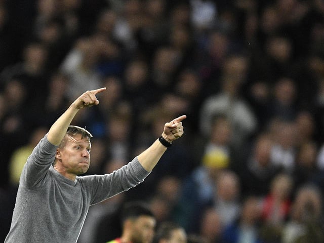 Jesse shouts the orders with fans in the background.